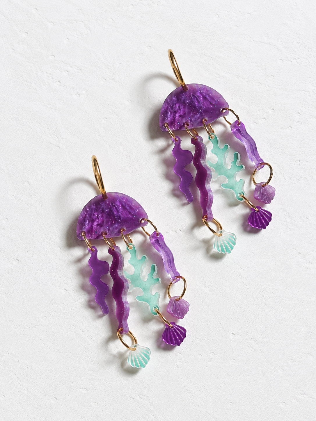 Pendientes medusas lila marmolado glitter 10 pares disponibles.Edicion limitada